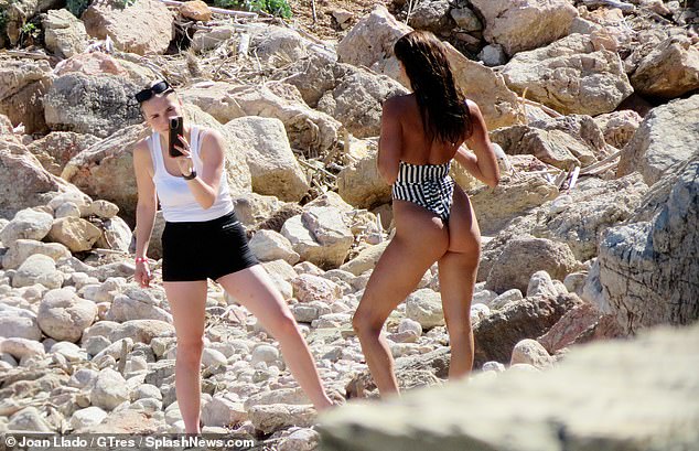 Strike a pose: Rebecca was spotted on the rocks posing for a slew of photos