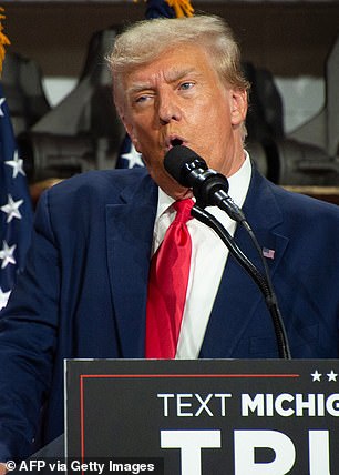 Former US President and 2024 presidential candidate Donald Trump speaks at Drake Enterprises, an auto parts manufacturer and supplier, in Clinton, Michigan