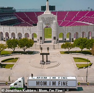 His message appeared on the side of a truck outside the Memorial Coliseum in Los Angeles, above