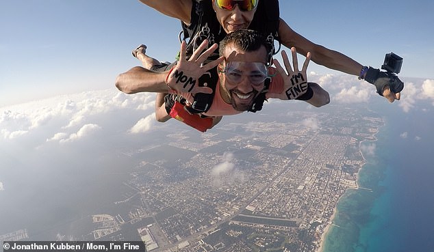 Jonathan says he originally planned to return to his job as a communications consultant when he stopped traveling in 2016.  Since then, his brand 'Mom, I'm fine' has reached millions of people and led to more business and projects.  Above is an earlier photo taken after he jumped from a plane over Playa del Carmen, Mexico