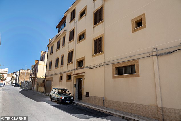 Denaro's house (pictured) with his mother's green Fiat car parked outside