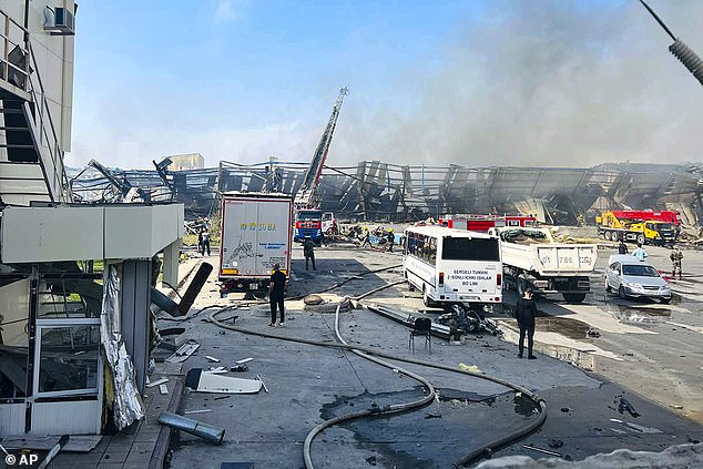 Firefighters are extinguishing a fire at a warehouse site in Tashkent, Uzbekistan