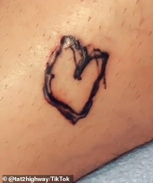 Wesley decided he would let Adeline tattoo him again, revealing: 'I decided to let Adeline tattoo a smiley face next to the heart she had tattooed last time'