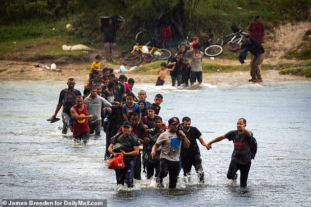 Stunning images have shown large numbers of migrants crossing difficult terrain and wading through the Rio Grande River on their way across the southern border