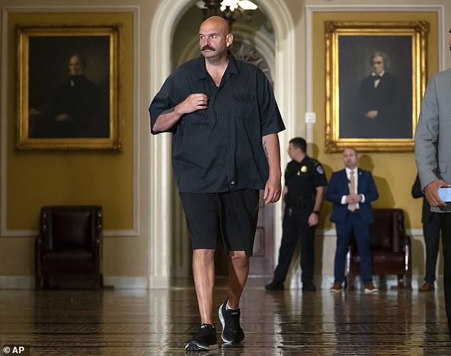 1695950986 871 John Fetterman scrubs up well in a suit and flashes