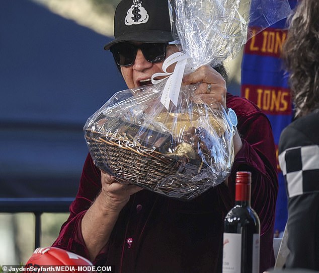 Gene showed off the basket of chocolates he had received as a gift from the Sunrise team