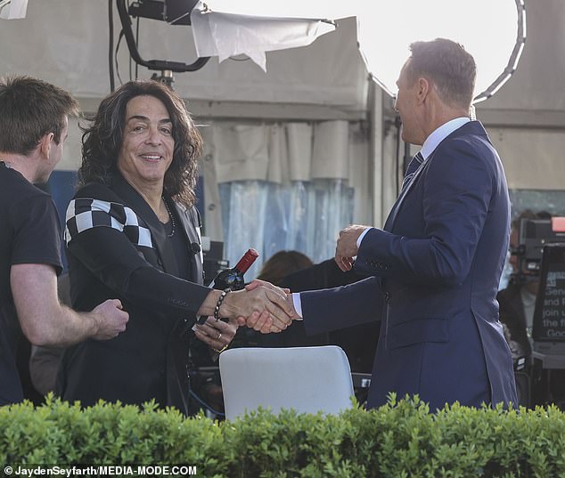 Host Matt 'Shirvo' Shirvington also seemed impressed as he was seen chatting and shaking hands with rock hero Paul, who was holding a gift bottle of red wine he received