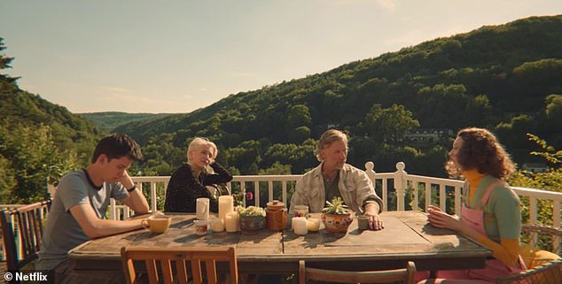 Otis (Asa Butterfield), Jean (Gillian Anderson), Jakob (Mikel Persbrant) and Lily (Tanya Reynolds) on the balcony in sex education