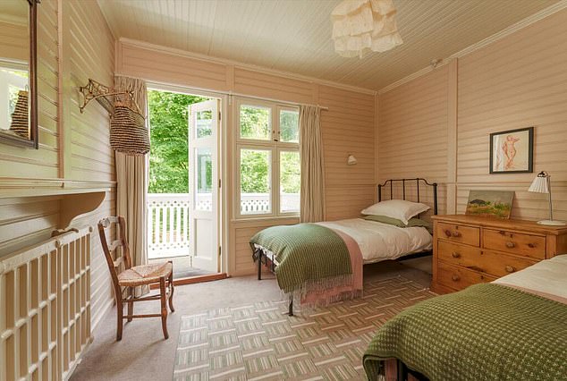 Three of the bedrooms on the first floor have a balcony with beautiful views of the forest