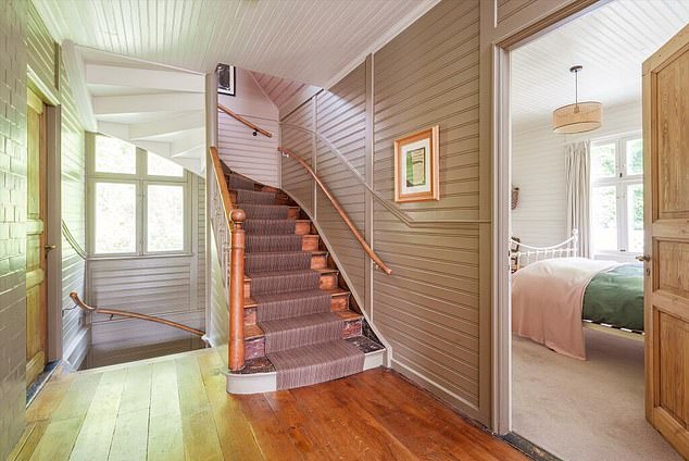 The central staircase, seen from the first floor, leads to four of the five bedrooms