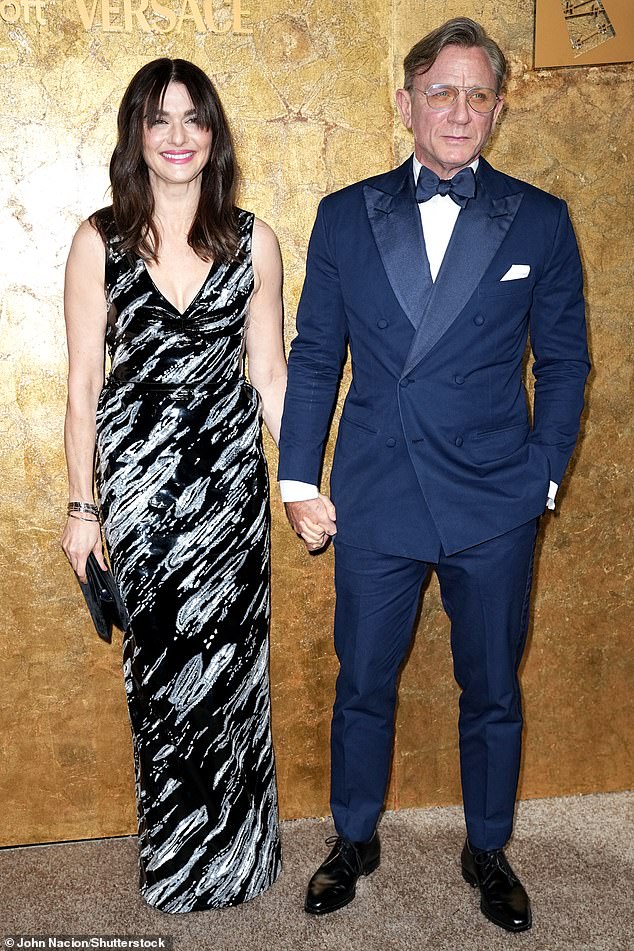 Lovely display: Rachel Weisz and Daniel Craig held hands as they attended the star-studded awards ceremony