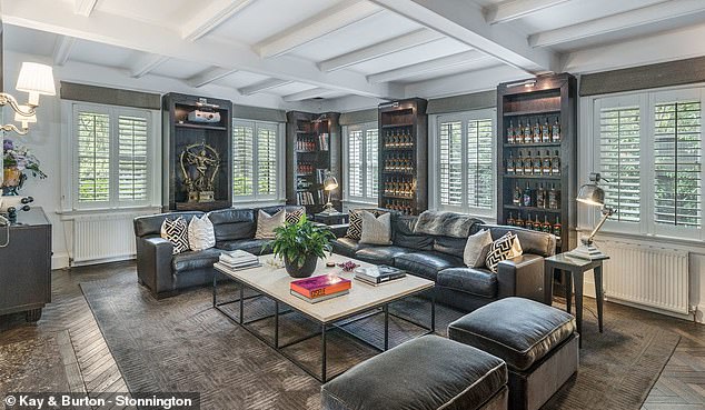 The country house, called 'Karum', retains much of its historic opulence and features fireplaces, coffered ceilings and wooden floors.  Pictured: one of the many living areas