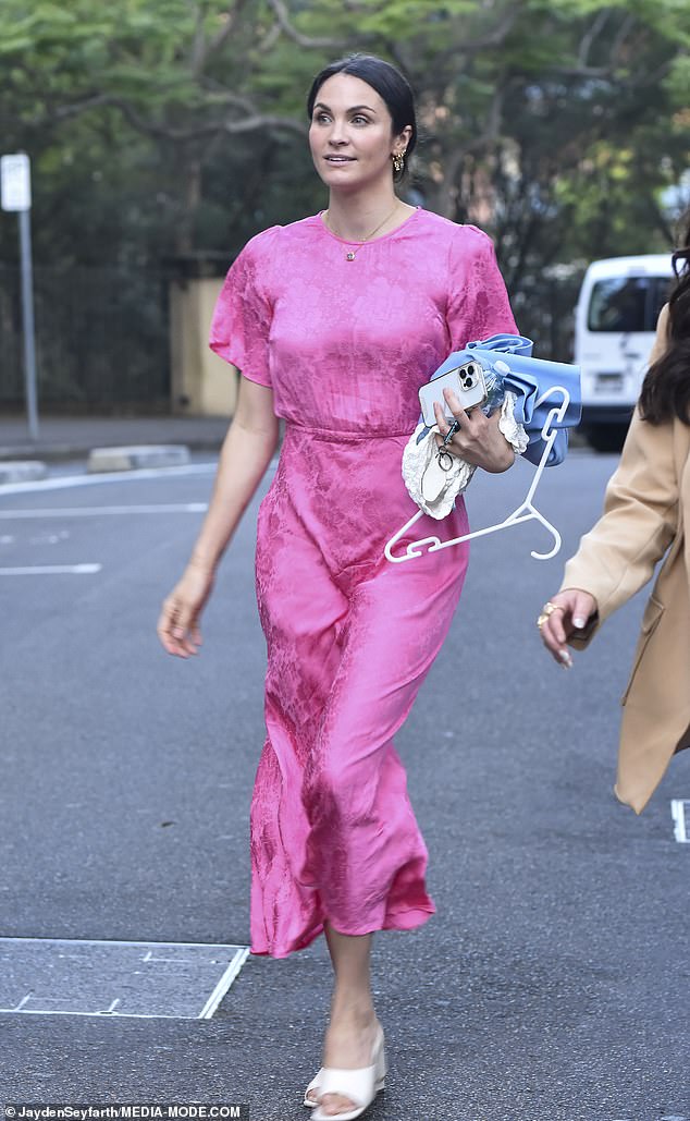 The women each wore chic ensembles, with Laura in a bright pink gown with loose sleeves and a slim silhouette