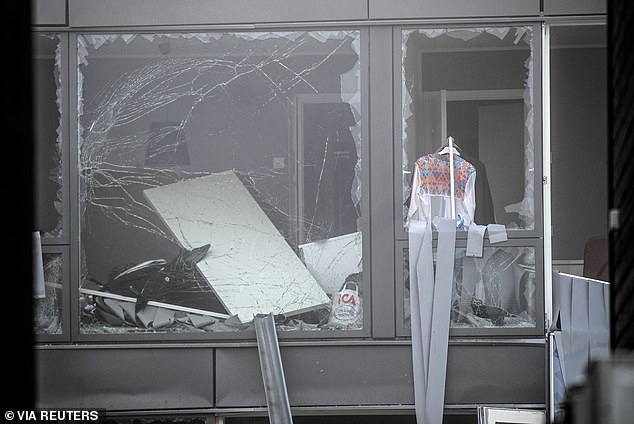 Footage from the bomb's aftermath shows the woman's building torn apart, while smashed windows hang haphazardly from the front of her home in a scene witnesses have likened to a war zone