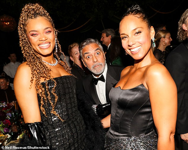 Funny sight...George looked dazzling as he joined Andra and Alicia Keys on the big night