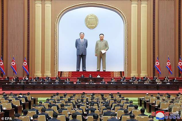 The models of the country's founder Kim Il Sung and successor Kim Jong Il were placed behind him on Tuesday before the Supreme People's Assembly in Pyongyang, where he demanded an 