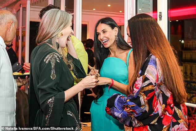 All smiles: Demi seemed in a jovial mood as she laughed and chatted with host Carmen Busquets and jewelry designer Daniela Villegas