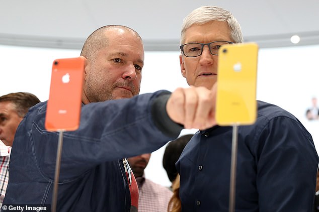 Ex-iPhone designer Sir Jony Ive (pictured left with Apple CEO Tim Cook, right) is in 'advanced talks' with OpenAI's CEO, Sam Altman, as the pair attempt to launch an AI-centric device to the mass market