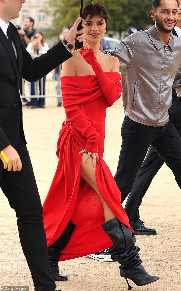 Sensational: Emily turned heads in her red dress