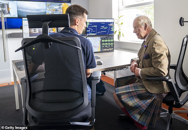 King Charles III helps pilot an underwater ROV (remotely controlled vehicle)