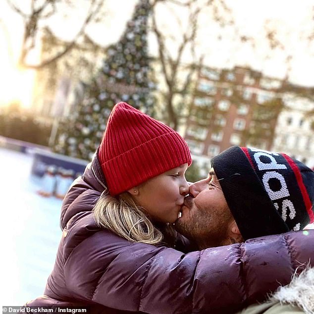 Not happy: In 2018, David shared a sweet photo of himself kissing then-seven-year-old daughter Harper while ice skating in London