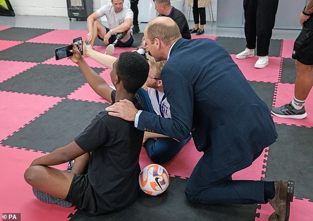 The Prince of Wales posed for selfies during a visit to the charity which provides mental health care for young people