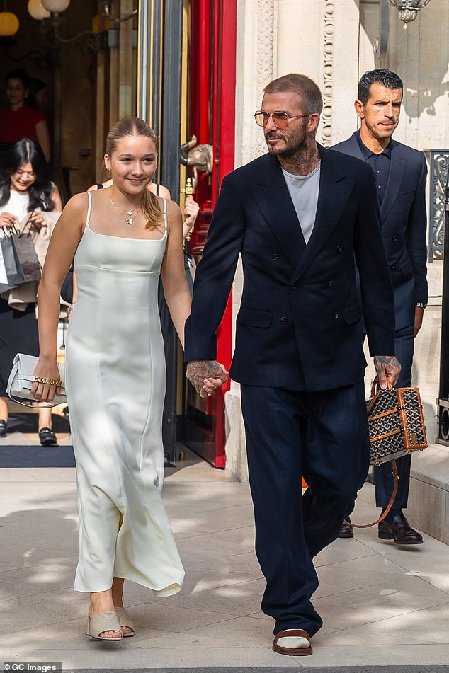 Fashionable: 12-year-old Harper proved she's inherited her mum's chic sense of style and took to the show in a fashionable white dress paired with £840 Prada mules