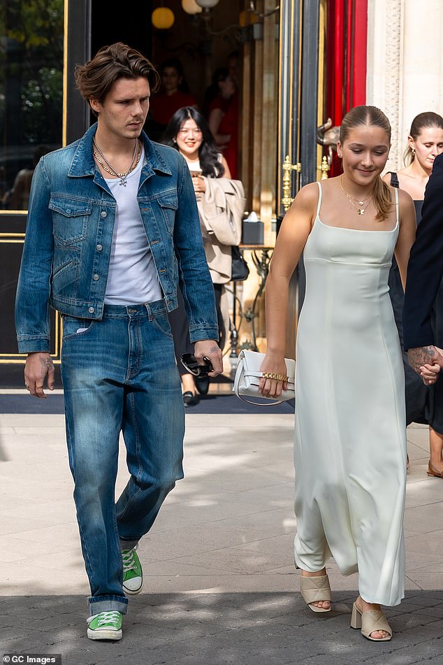 Looking good: Also heading to the show was Cruz, 18, who paid tribute to the 1990s in double denim, pairing a jacket and jeans with green Converse shoes