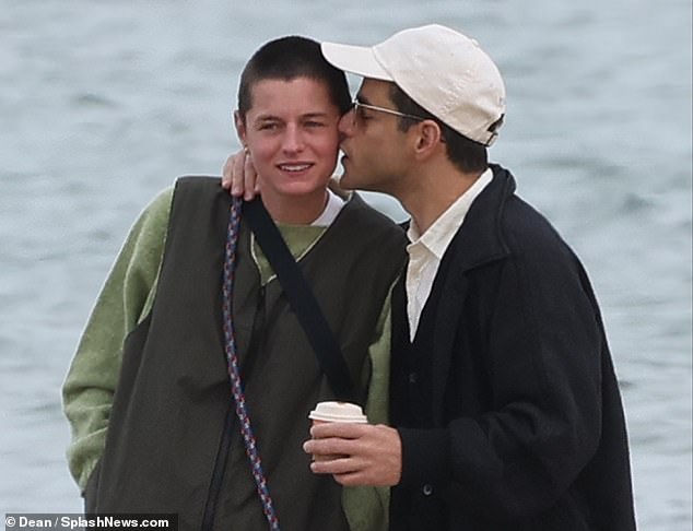 Puckers: While Lucy enjoyed her night out, Rami and his new girlfriend Emma Corrin packed on the PDA along the beach in Kent earlier today