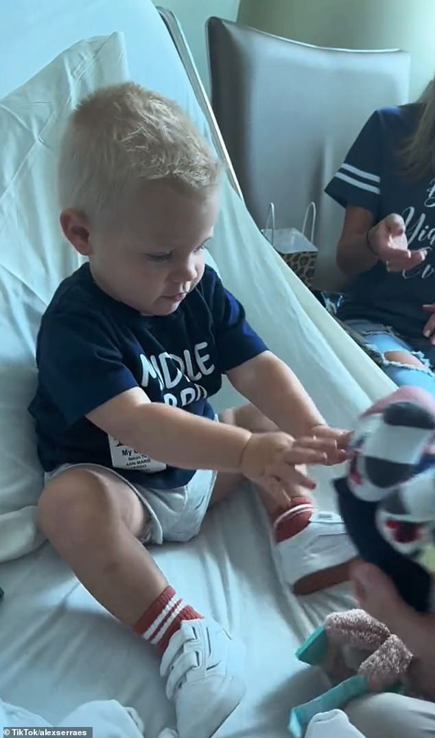 The adorable middle child, who was 20 months old at the time of the clip, according to Today, pushed away his little brother Theo, who started whining as soon as he was rejected by his older brother.