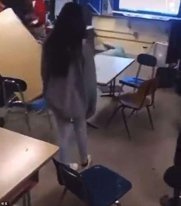 The teacher lay cold on the ground as the stunned students gathered around him