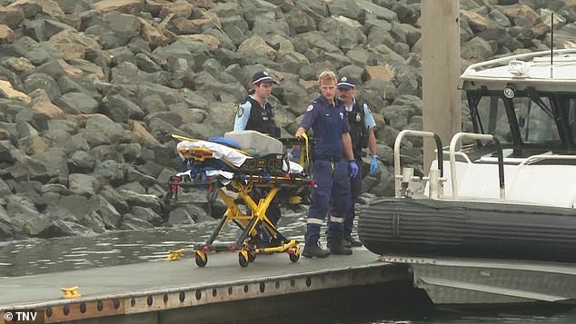 The second man was pulled from the water and taken to hospital by NSW Ambulance paramedics in a stable condition (photo, emergency services on scene)