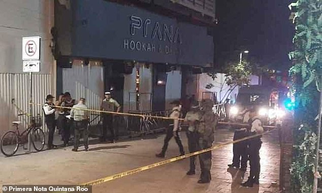 Police and military guard the area surrounding an entertainment district in Playa del Carmen, Mexico, where a Canadian woman suffered a gunshot wound to the leg.  The victim was treated at a local hospital and released