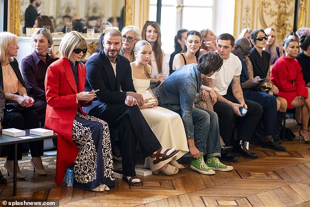 Front row action: Longoria (far right) sat in the front row with the likes of Anna Wintour, Victoria's husband David Beckham and their daughter Harper and son Cruz