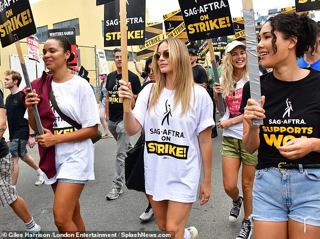 Protest Barbie!  Margot Robbie joined her fellow actors at a SAG-AFTRA meeting in September, along with Australian actress Samara Weaving, pictured behind her