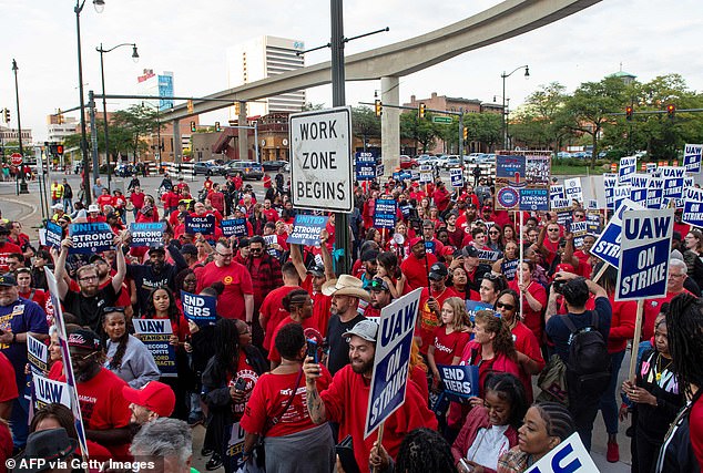 UAW workers march through the streets of downtown Detroit after a rally on the first day of the UAW strike in Detroit, Michigan, on September 15, 2023