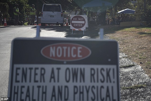 Residents were provided with gloves, goggles and hazmat suits to protect them from the toxic fumes and soot left over from the deadly wildfires