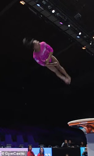 She spun around the bar and landed perfectly on the beam