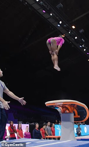 She spun around the bar and landed perfectly on the beam