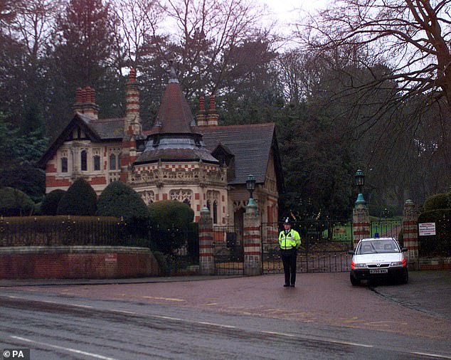 Intruder: After the 1999 burglary, a police officer is kept on guard outside the entrance to Friar Park