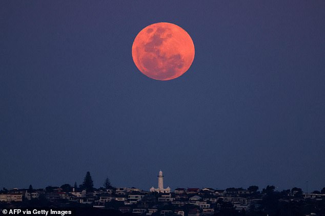 The Harvest Moon over Sydney's Macquarie Lighthouse last night