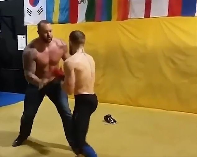 Bjornsson sparred with MMA star Conor McGregor in 2015, appearing in black shoes and jeans