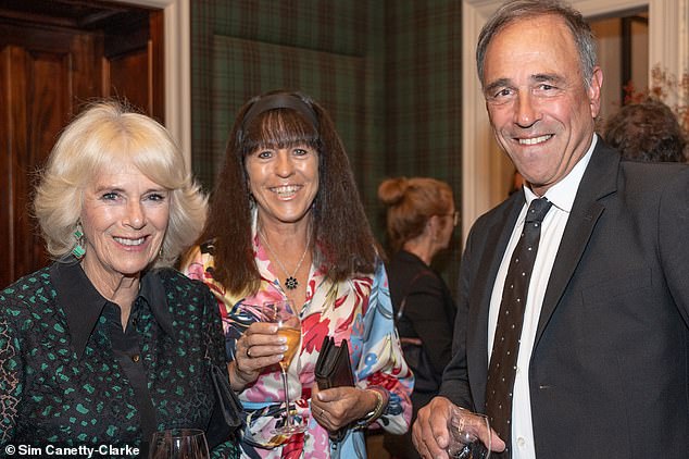 The King's wife (pictured left), 76, made a stylish appearance in the emerald-patterned dress while attending dinner at The Fife Arms hotel in the Scottish Highlands