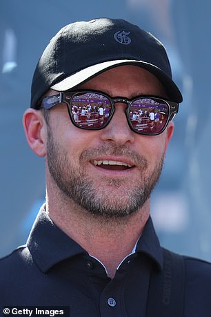 Timberlake, seen in a gallery, was dressed in all black, with a polo, cap and sunglasses