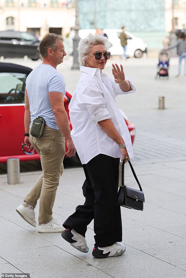 Happy: Florence seemed cheerful as she grinned from ear to ear and waved to passersby