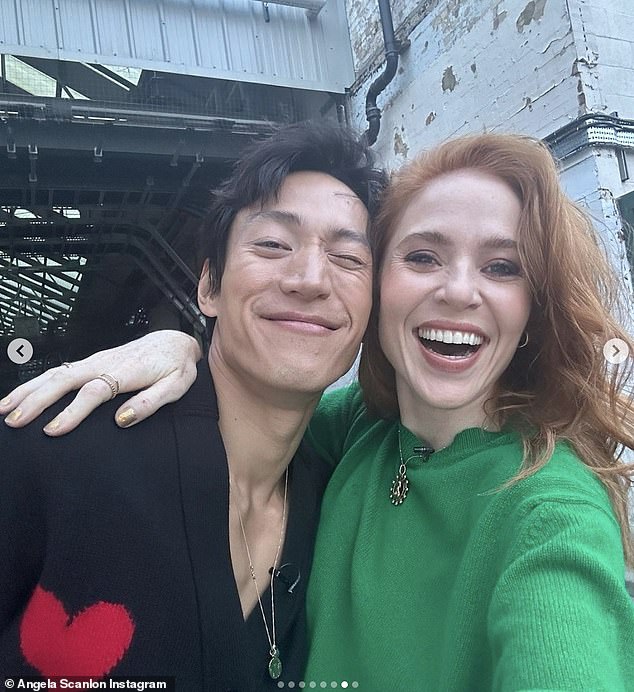 Big smile: The Oi Ginger!  host looked radiant as she beamed for a selfie next to her dance companion, donning a stunning green sweater