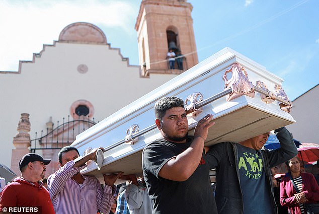 Relatives carried the coffin of teenager Diego Rodriguez Vidales, one of six boys found dead at the remote farm