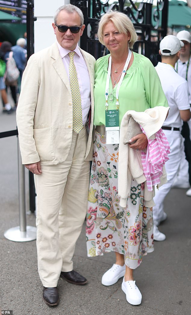 Actor Hugh Bonneville and his wife Lulu Williams attend day four of the 2022 Wimbledon Championships at the All England Lawn Tennis and Croquet Club, Wimbledon