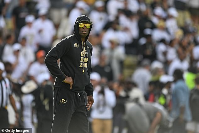 Colorado Buffaloes head coach Deion Sanders walks across the field in Boulder