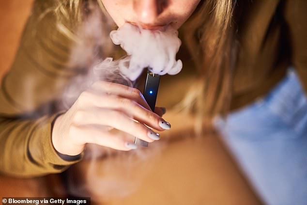 University of Florida researchers say millions of Americans involuntarily breathe in smoke from vapes and cigarettes (stock image)